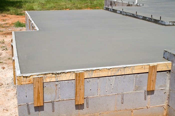 Concrete foundation built on top of cinder blocks.